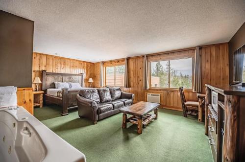 a living room with a couch and a bed at Superior Shores Resort in Two Harbors
