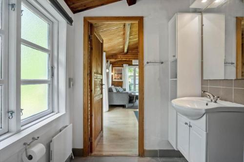 a bathroom with a sink and a mirror at 3032-Stege-Ankeret-4 in Stege