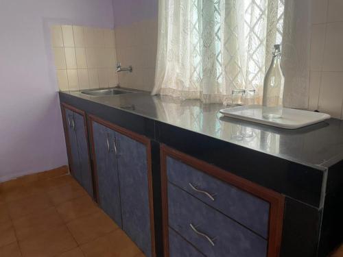 a bathroom with a counter with a sink and a sink at Hotel White Sand Bache Stay in Aguada