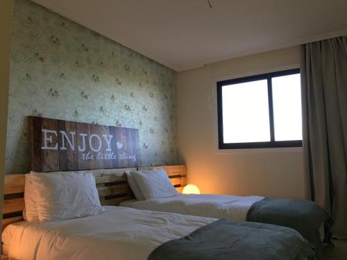 Tempat tidur dalam kamar di Apartment Calcada