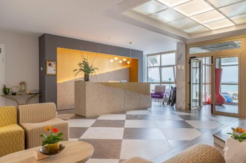 a living room with a couch and a table at Hotel Faranda Rias Altas, Ascend Hotel Collection in Oleiros