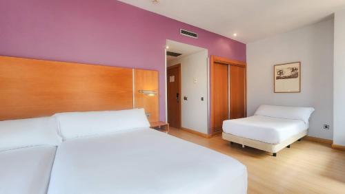 a bedroom with a large white bed and a white mattress at Hotel Faranda Marsol Candas, Ascend Hotel Collection in Candás