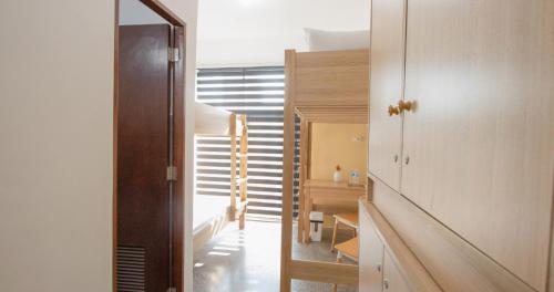 a room with a hallway with a staircase and a mirror at The Pad CoLiving in Cebu City