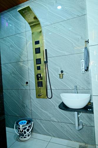 a bathroom with a sink and a mirror at Gehlot Paradise Hotel in Nāgaur