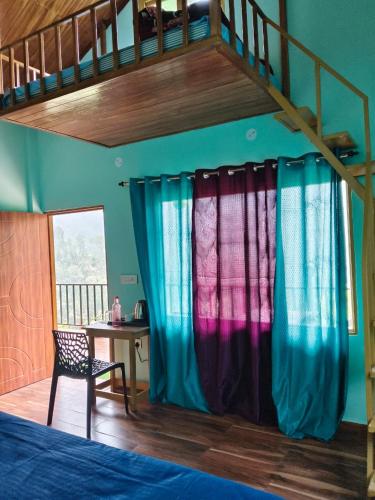 a bedroom with colorful curtains and a bunk bed at Jungle Valley Camp & Resort in Nainital
