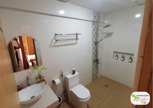 a bathroom with a white toilet and a sink at Newly Built Private Villa with Pool in Cainta in Cainta