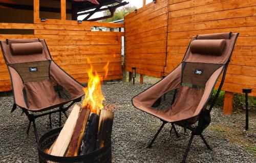 two chairs around a fire pit in a backyard at Komorebi/こもれび in Takayama