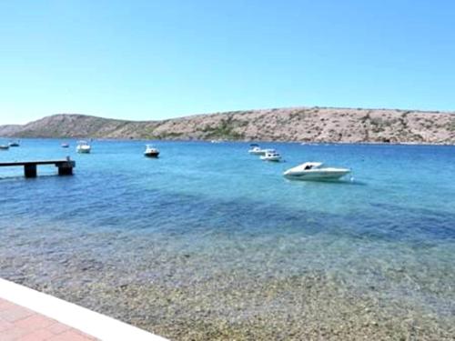 a group of boats in a large body of water at Villa Petra in Rab