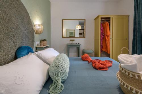 a bedroom with a bed with two stuffed animals on it at Casa Dell Artista with private jacuzzi in Kos