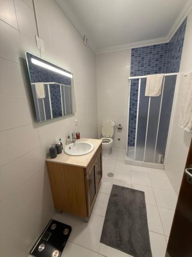 a bathroom with a sink and a toilet at Montejunto Escape in Cadaval