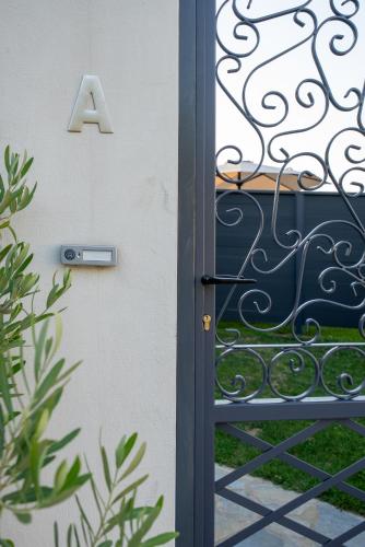 a door with the letter a on it at Catherine's Seaside House A in Stomio