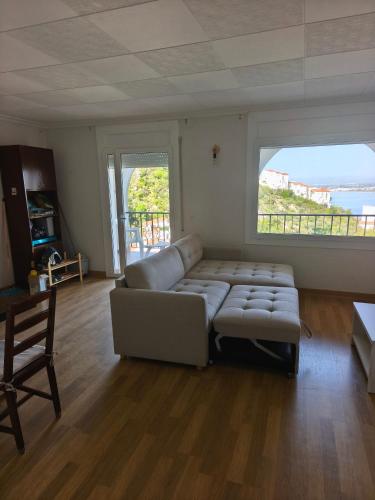 a living room with a couch and a table at Puig Rom Pau Vila in Roses