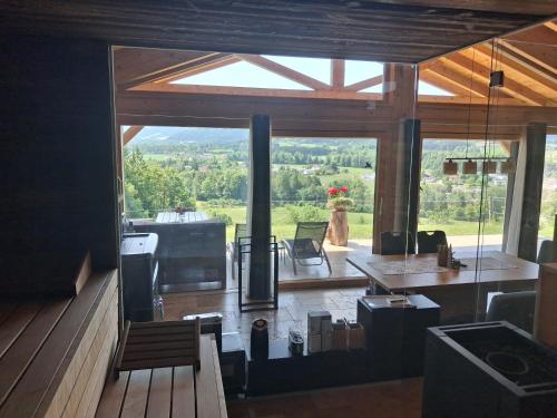 a large living room with a view of a mountain at Almtalblick in Pettenbach