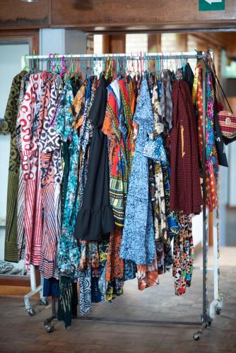 a rack of clothes on display in a store at INTAGARA Handcrafts in Butare