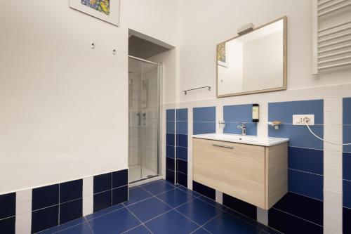 a bathroom with a sink and a mirror at villa oltremare resort in Bagheria