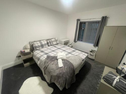 a bedroom with a bed and a window at Silverhill in Bradford