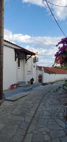 an empty street in front of a house at Angelina's House in Glossa