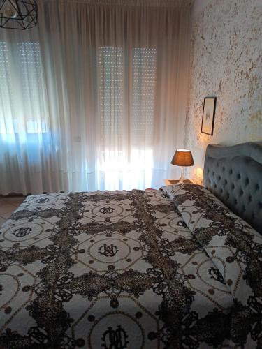 a bedroom with a bed with a rug on it at levIole in Belfiore