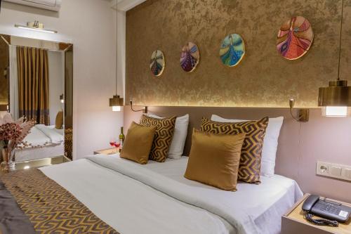 a hotel room with a bed and a mirror at Ayramin Deluxe Hotel - Anex in Istanbul
