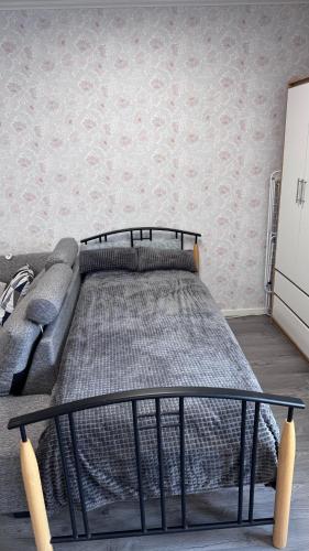 a bed in a living room with a couch at Green Forest Oasis & Sea in Strömstad