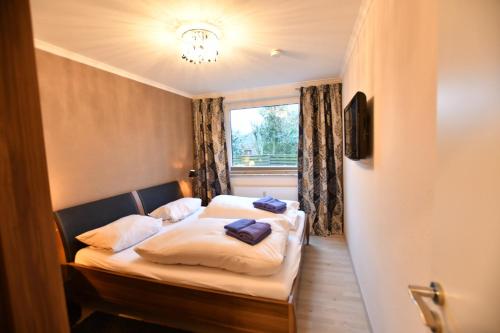 Llit o llits en una habitació de Wohnung Holly, 44B