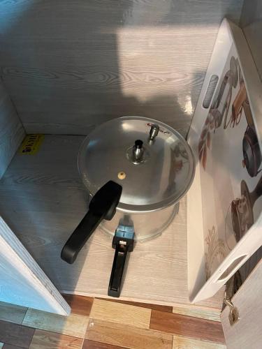a sink in a box with a remote control at Baam-E-Noor , Pine Tree Resort , Margalla Hills Islamabad in Harīpur