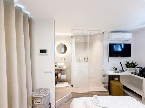 a bathroom with a shower and a sink at Sky Garden - luxury suite in Monopoli