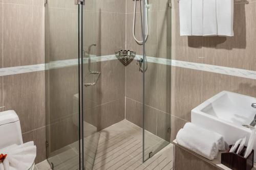 a bathroom with a shower and a sink at The Grand Palm Villa in Ban Bang Phrao
