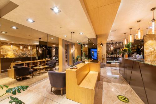 a bar in a restaurant with chairs and tables at Ayramin Deluxe Hotel - Anex in Istanbul
