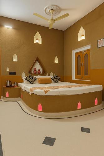 a bedroom with a large bed in a room at VVIP Gajban Resort & Desert Stay, Bikaner in Bikaner