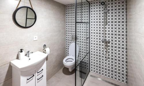 a bathroom with a toilet and a shower and a sink at Tarasova in Zbudský Rokytov