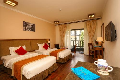 Кровать или кровати в номере Atithi Resort & Spa