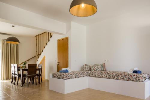 a living room with a couch and a table at PhώS Casa Lachania in Lachania