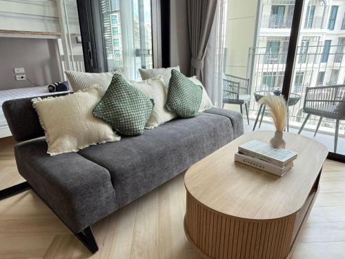 a living room with a couch and a coffee table at The Legendary Bang Tao 2-bedrooms apart #402 in Bang Tao Beach