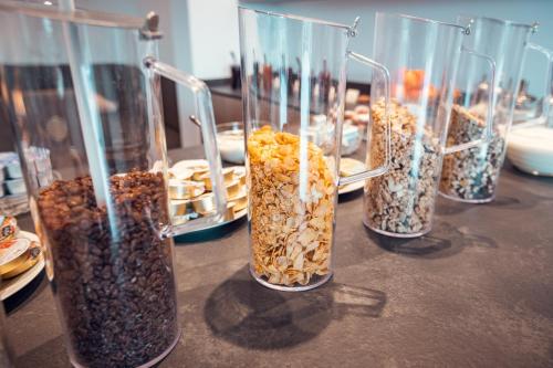 a group of glass vases filled with different types of seeds at Gass-Hof in Caldaro