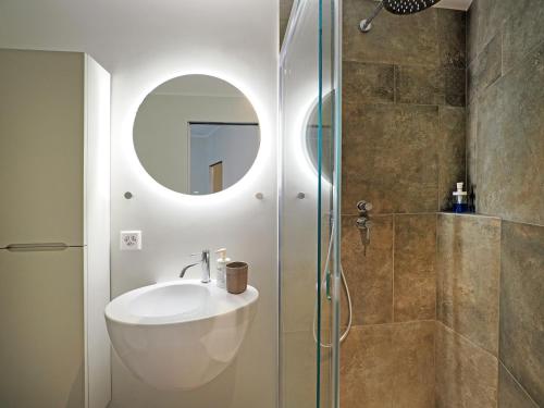 a bathroom with a sink and a shower at Appartamento Food Truck 11 in Muralto