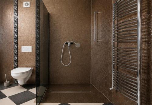 a bathroom with a shower and a toilet in it at Vila Natalija in Ljubljana