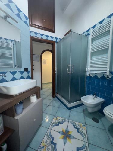 a bathroom with a shower and a sink and a toilet at Sibilla Flegrea in Pozzuoli