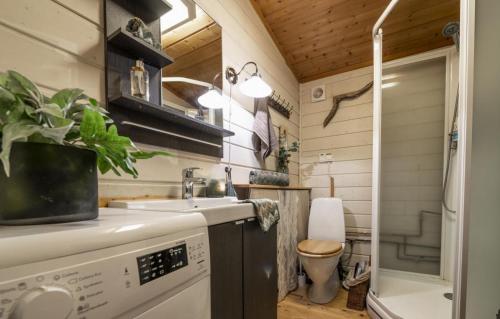 a tiny bathroom with a sink and a toilet at Villa Fregn in Ljørdalen