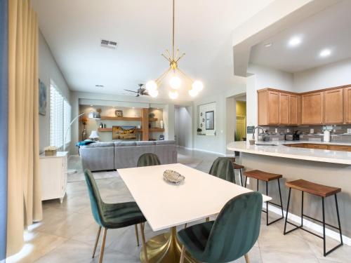 a dining room and kitchen with a table and chairs at Anthem Allure in Phoenix
