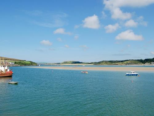 a large body of water with boats in it at Treyarnon in Saint Merryn