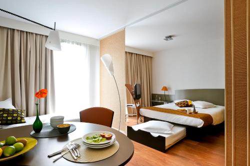 Un ou plusieurs lits dans un hébergement de l'établissement Aparthotel Adagio Nantes Centre