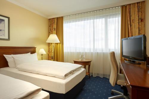 Televisyen dan/atau pusat hiburan di H4 Hotel Kassel