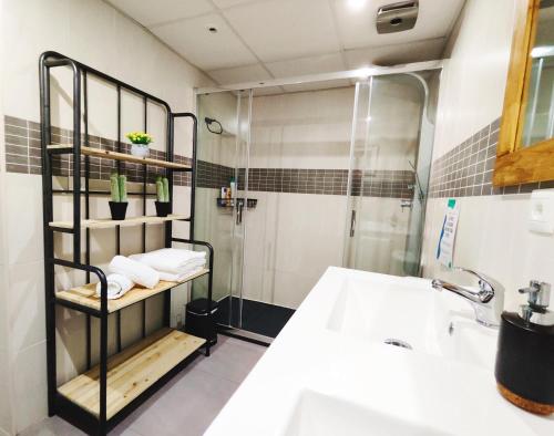 a bathroom with a shower and a sink at Chill and Beach in Torremolinos
