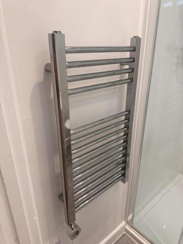 a stainless steel radiator on a white wall at Star Studios in Southampton