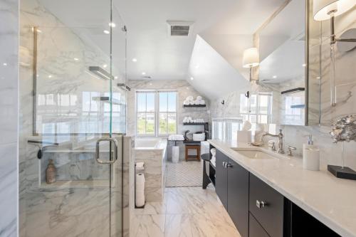 a bathroom with a shower and a sink at Luxury York Oceanfront Nubble Views in York