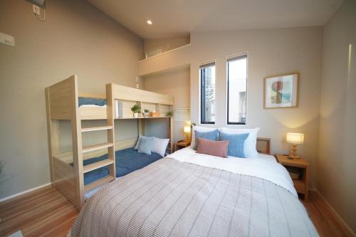 a small bedroom with a bed and a book shelf at LinksHotel 西荻窪 in Ogikubo