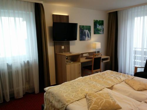Cama o camas de una habitación en Wellness Hotel Garni Krone