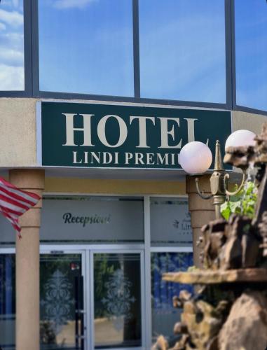a hotel sign on the front of a building at Lindi Premium Hotel in Prizren