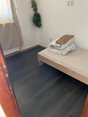 a room with a bed with two pillows on it at jack hostel with private bathroom in Sremski Karlovci